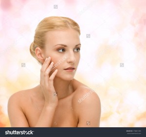 beauty and spa concept face of beautiful woman touching her face skin